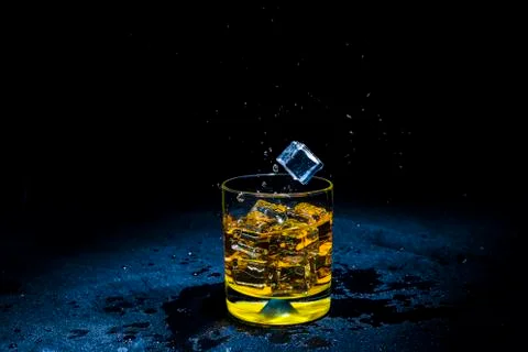 Ice with liquid splashing. Stock Photos