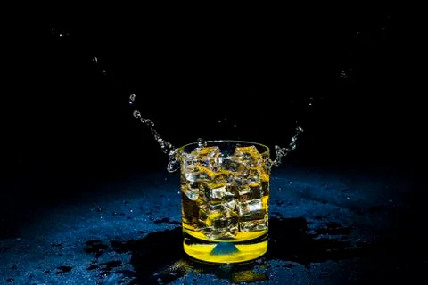 Ice with liquid splashing. Stock Photos