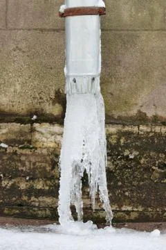 Ice on low end of drainpipe Stock Photos