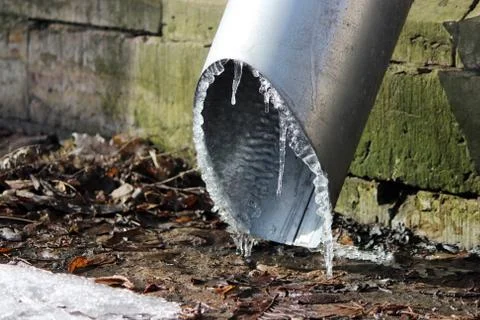Ice on low end of drainpipe Stock Photos
