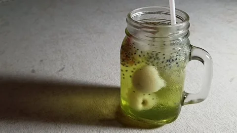 Ice Lychee and strawberry squash in a jar Stock Footage 158977606