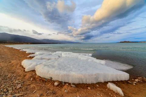 The ice lying on the shore Stock Photos