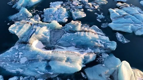 Ice Melting and Water Flow Video Capturing Nature's Stock Footage 296546027