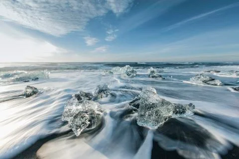 Ice melting on the beach Stock Photos