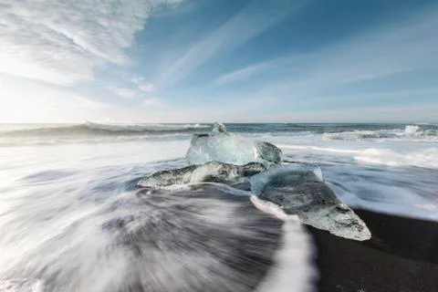 Ice melting on the beach Stock Photos