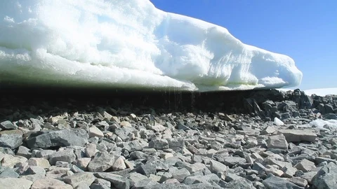 Ice melting onto rocks in Antarctica Stock Footage 88285978