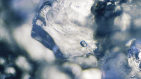 Ice Melting with Water Bubbles (Close-Up) Stock-Footage 64901400