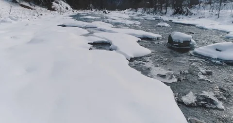 Ice melts - the river flows. View of a mountain river in the Carpathians in Stock Footage 123277959