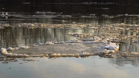 Ice melts river sunset current, fading day warmth, shimmering water tranquil Stock Footage 278064129