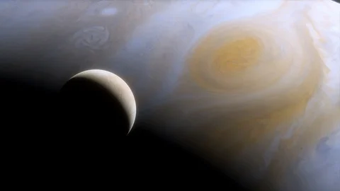 Ice moon Europa on the background of large gas planet Jupiter. Great Red Spot Vídeo Stock 118917370