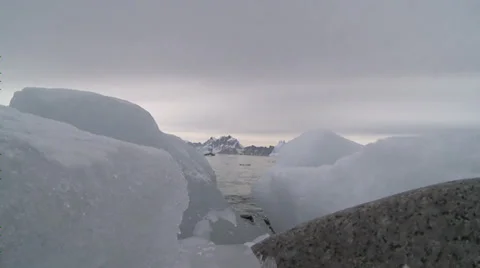 Ice with mountain behind, Antarctica Stock Footage 34312029
