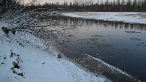 Ice movement along the river, winter landscape at sunset Stock Footage 163877038