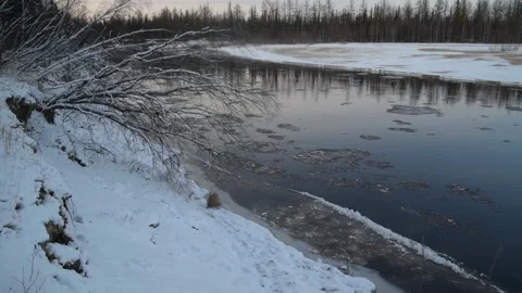 Ice movement along the river, winter landscape at sunset Stock Footage 163877043