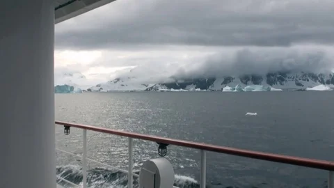 Ice movement and snow iceberg and glacier view from ship in ocean of Antarctica. Stock Footage