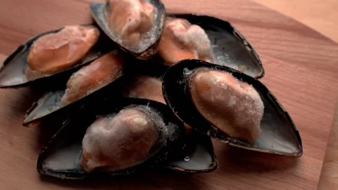 Ice mussels in shell on board on table. HD Stock Footage 141591668