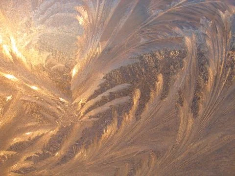 Ice natural pattern and sunlight on glass Stock Photos