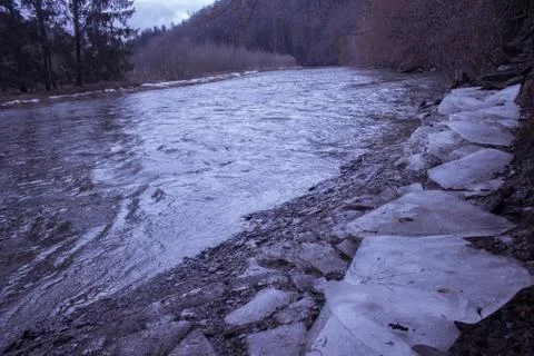 Ice next to river Stock Photos
