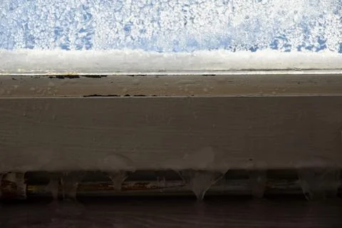Ice on the old window frame house Stock Photos