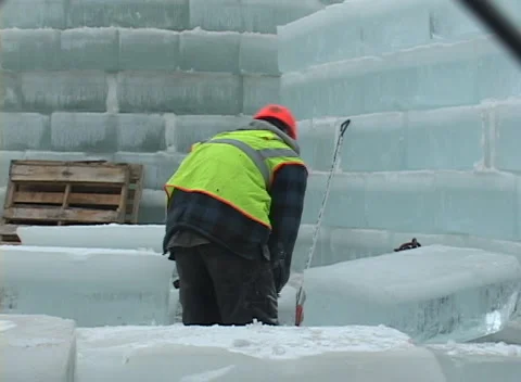 Ice Palace construction 1, workers cut and position large blocks of ice Stock Footage 296343585