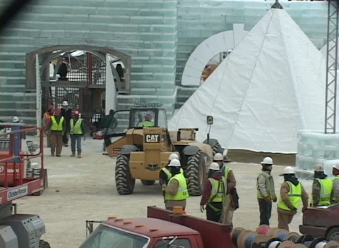 Ice Palace construction 4, workers prep and lift fabric pointed canopy Stock Footage 296343829