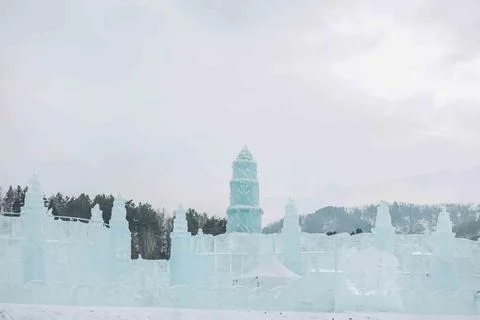 Ice palace, inviting ice structure set in a picturesque winter landscape, per Stock Photos