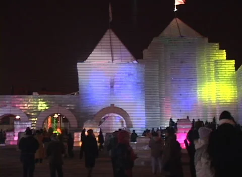 Ice Palace light show 4, very colorful changing lights, people foreground Stock Footage 296344684
