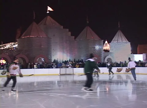 Ice Palace light show ice rink 7, hockey rink foreground with skaters Stock Footage 296345875