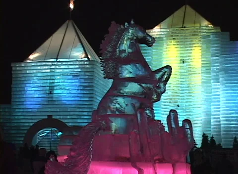Ice Palace night lights 9, close detail of horse sculpture w changing colors Stock Footage 296346747