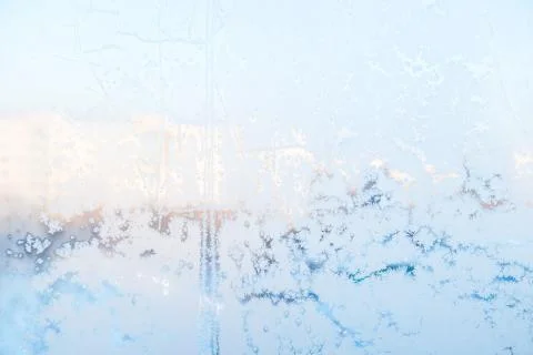 Ice pattern on the frosty window. Beautiful winter background. Stock Photos
