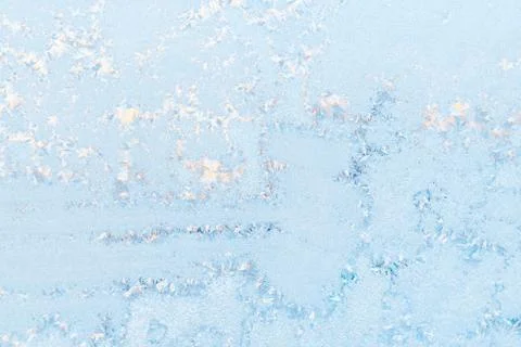 Ice pattern on the frosty window. Beautiful winter background. Stock Photos