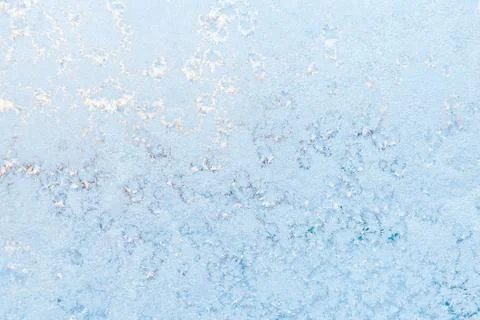 Ice pattern on the frosty window. Beautiful winter background. Photos
