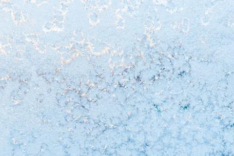 Ice pattern on the frosty window. Beautiful winter background. Stock Photos