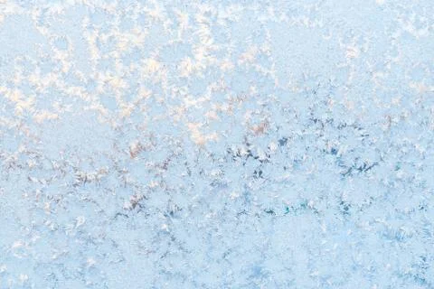Ice pattern on the frosty window. Beautiful winter background. Stock Photos