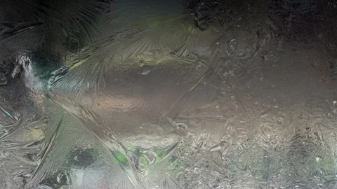 The ice pattern on the glass melts Stock Footage 88450752