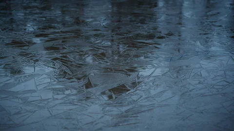 Ice pattern that is lying above the water in a lake in Norway on a cold winter Stock Footage 321801466