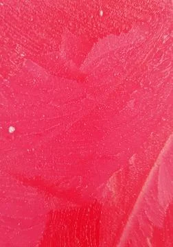 Ice pattern on a red painted background Stockfoto's