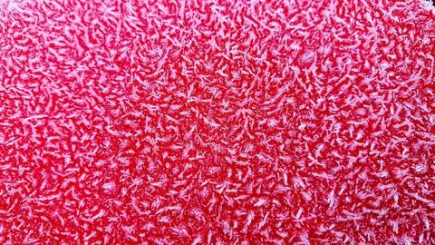 Ice pattern on a red painted background Stock Photos