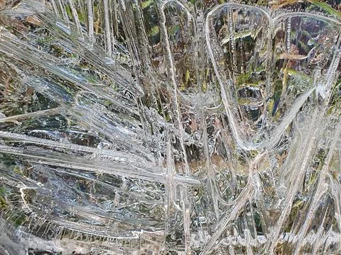 Ice pattern on a shallow puddle of water Stock Photos