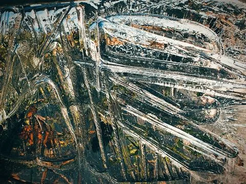 Ice pattern on a shallow puddle of water Stock Photos