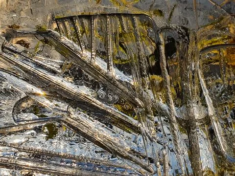 Ice pattern on a shallow puddle of water Stock Photos