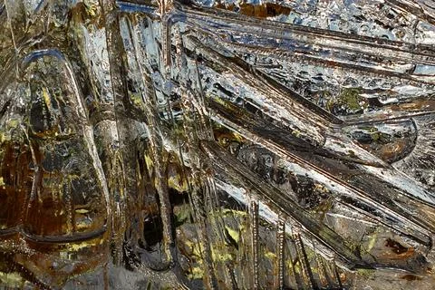 Ice pattern on a shallow puddle of water Stock Photos