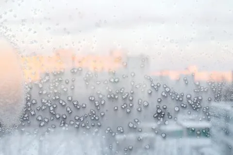 Ice pattern on window, winter background. Texture. Stock Photos