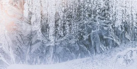 Ice pattern on the winter window. Frost drawing texture. Stock Photos