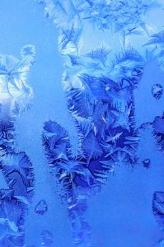 Ice pattern on winter window glass Stock Photos