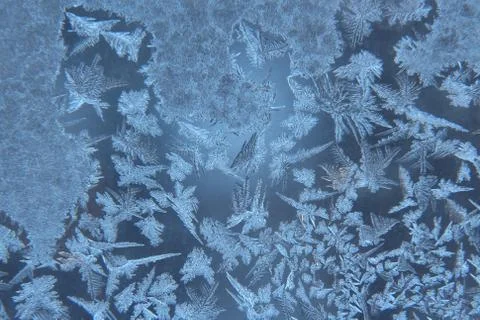 Ice patterns on frozen window Stock Photos