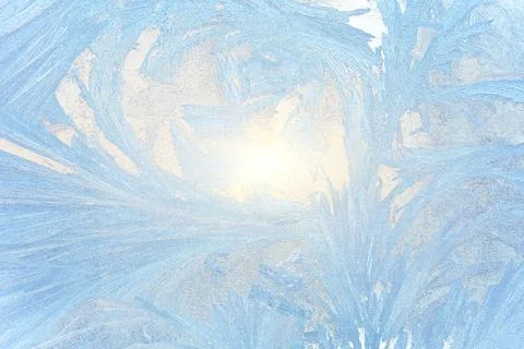 Ice patterns on glass, snow on the window, winter background Stock Photos