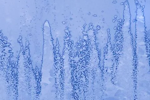 Ice patterns on winter glass Stock Photos