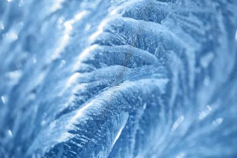 Ice patterns on winter glass Stock Photos