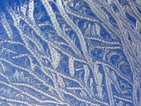 Ice patterns on winter glass Stock Photos
