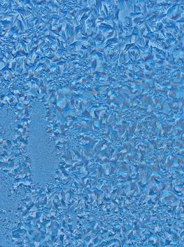 Ice patterns on winter glass Stock Photos